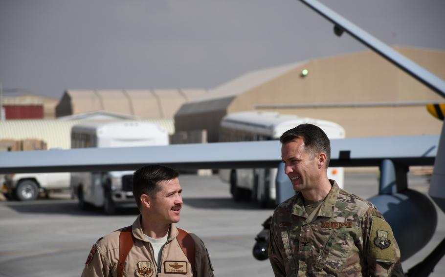 A-10 Thunderbolt II pilot Lt. Col. Todd ''Riddler'' Riddle, left, of the 303d Expeditionary Fighter Squadron, speaks with Col. Stephen ''Joker'' Jones, commander of the 451st Air Expeditionary Group, during a news conference announcing the arrival of a squadron of A-10s and additional MQ-9 Reaper drones at Kandahar Air Field, Afghanistan, on Tuesday, Jan. 23, 2018.