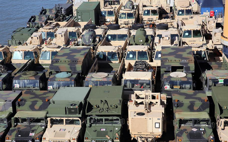 Dozens of military vehicles sit last spring on the top deck of heavy-lift vessel Ocean Jazz, which were used in the Talisman Sabre exercise in Australia as part of the Army's  Pacific Pathways.