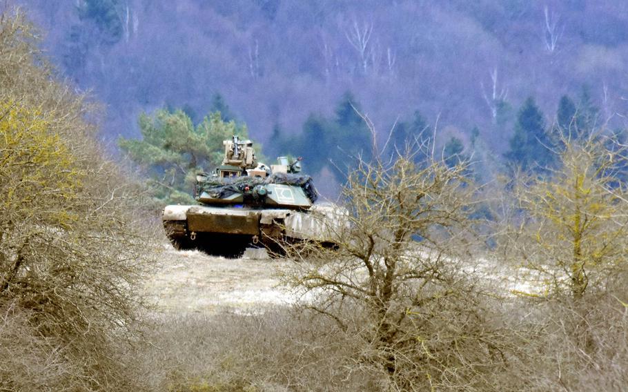 An M1A2 Abrams Tank is perched on a hill during the Allied Spirit VIII exercise in Hohenfels, Germany, Monday, Jan. 29.