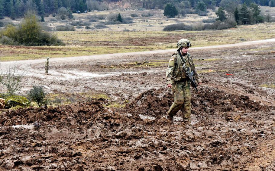 U.S. Army Spc. Rosa Bens walks through a field of mud during the Allied Spirit VIII exercise at Hohenfels, Germany, Monday, Jan. 29, 2018.