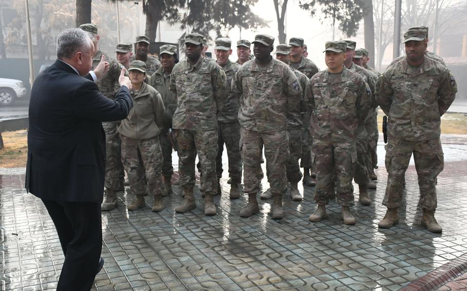 Deputy Secretary of State John J. Sullivan gives the thumbs-up to U.S. troops at NATO's Resolute Support headquarters in Kabul, Afghanistan, on Tuesday, Jan. 30, 2018.