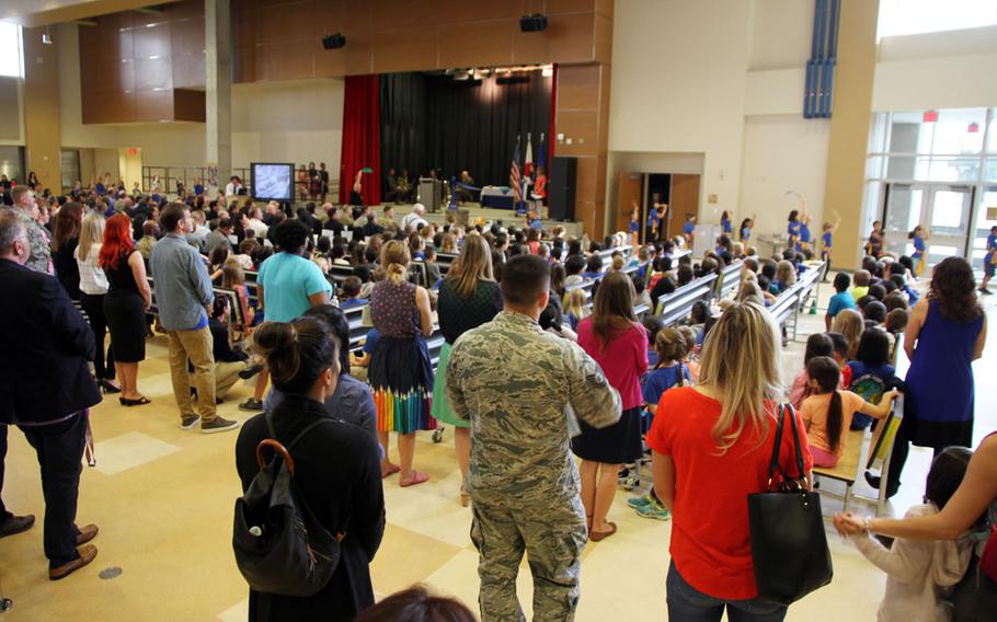 Students, teachers, administrators and parents gather inside the new Kadena Elementary cafeteria during the school's grand-opening, Wednesday, Feb. 28, 2018.