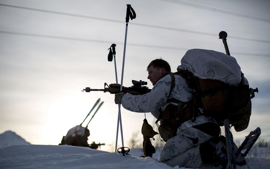 A Marine moves into position before conducting a mountainous assault on enemy position during exercise White Claymore near Bardufoss, Norway, Feb. 15, 2018.