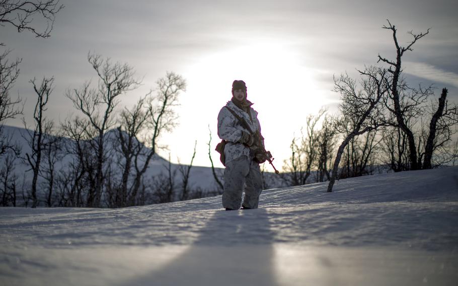 A Marine moves into position before conducting a mountainous assault during exercise White Claymore near Bardufoss, Norway, Feb. 15, 2018.