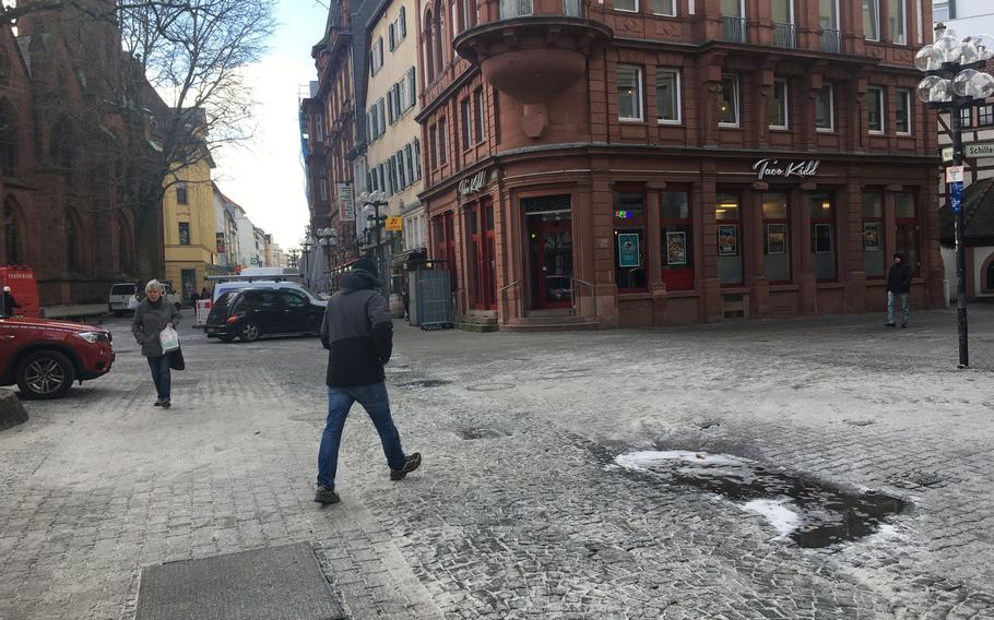 People walk along the pedestrian zone in downtown Kaiserslautern, Germany, on Monday, Feb. 26, 2018. A German man was arrested in the downtown area on Wednesday, Feb. 28, 2018, after firing a starter pistol in the street.