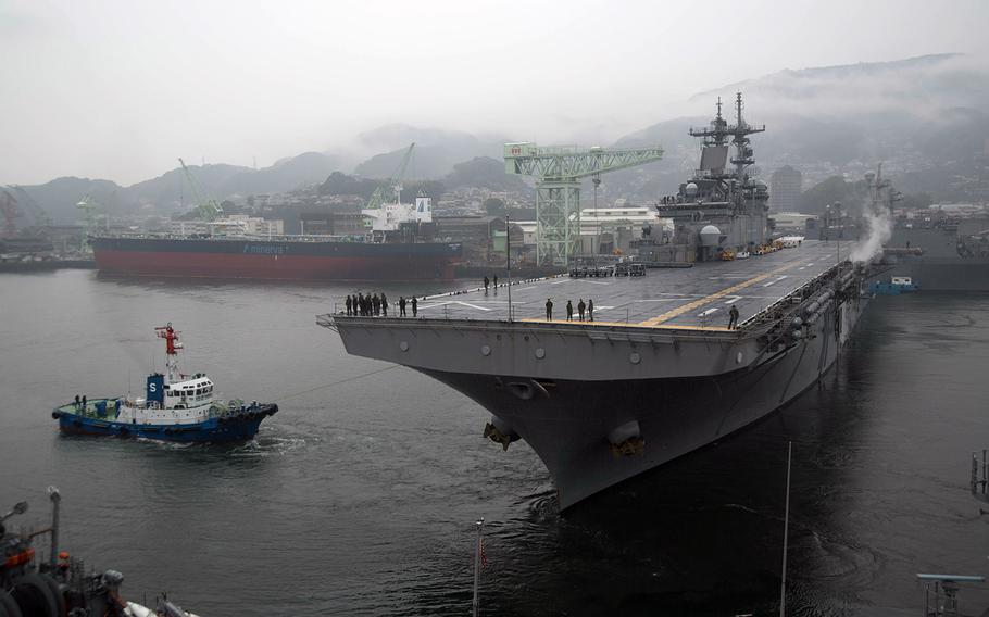 The amphibious assault ship USS Wasp departs Sasebo Naval Base, Japan, Saturday, March 3, 2018.