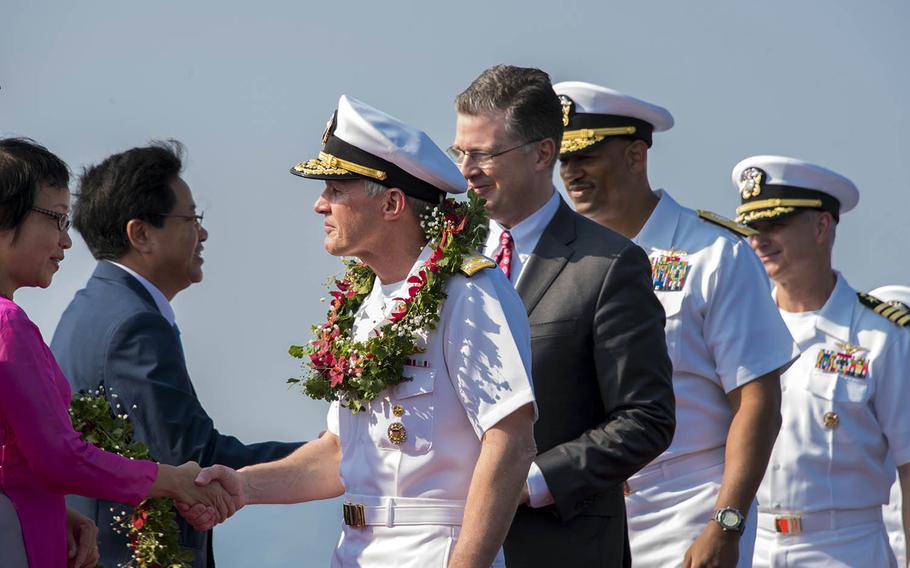 Leaders from Vietnam and the United States take part in a welcome ceremony after the USS Carl Vinson arrived in Danang, Vietnam, Monday, March 5, 2018.