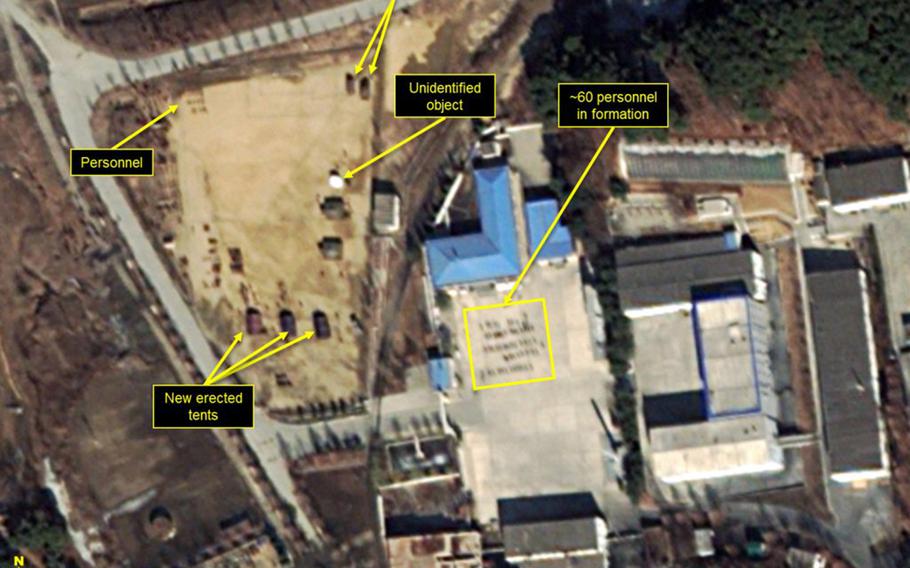 38 North said the 5-megawatt reactor at North Korea's Yongbyon nuclear complex shows signs of operation. It also spotted a new military tent camp established last month on the complex, more personnel and two large open-bed trucks.