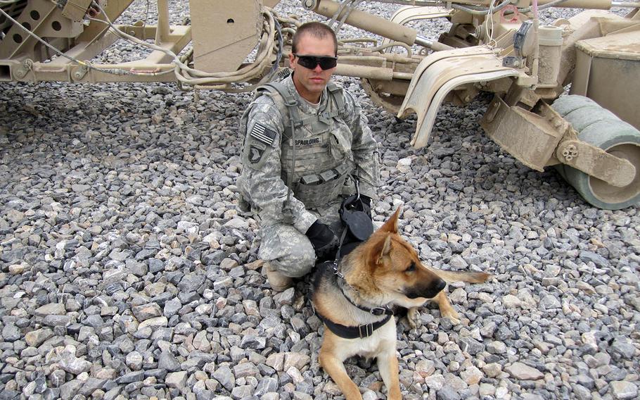 Army specialist Andrew Spaulding and tactical explosives detection dog Bono, the dog he handled, during Bono's first deployment in Afghanistan in 2010. Bono deployed with a different handler again in 2012.