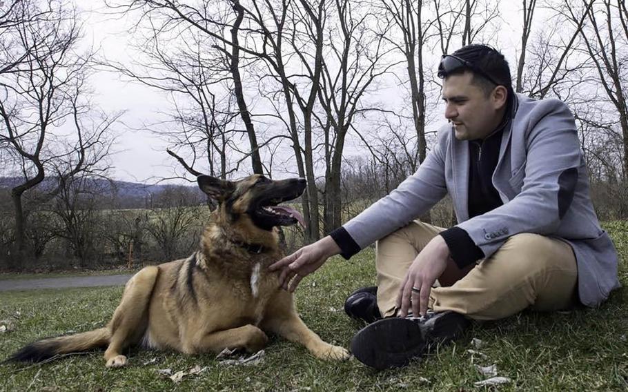 31p bs
Tactical explosives detection dog Ben and his former handler, National Guardsman Julio Munoz, get reacquainted during their reunion in York, Pennsylvania in 2016. Ben's adopted owner Kim Scarborough sought out Munoz after she got the dog from the Army in 2014.