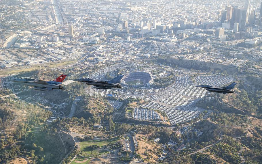 Three F-16 Fighting Falcons from Edwards Air Force Base fly past Dodger Stadium after a ceremonial flyover for Game Two of the World Series, Oct. 25, 2017.