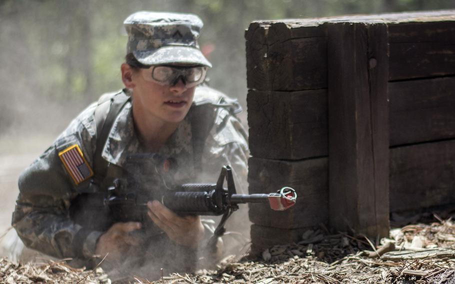 U.S. Army recruit Madison Elam, 19, of Vandalia, Ohio, rushes into position to cover her battle buddy during basic training at Fort Jackson, S.C., in 2015.  A new study found that unit cohesion was unaffected by adding women.