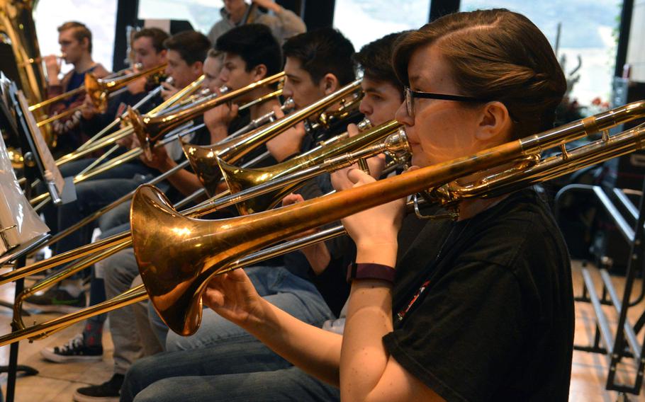The trombone section of the DODEA-Europe Honors Band rehearses a number at this year's Honors Music Festival, Tuesday, March 13, 2018.