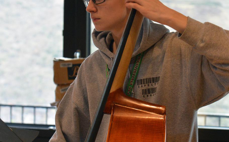 String bassist Jacob Nelson of Aviano waits for his cue at this year's DODEA-Europe Honors Music Festival, Tuesday, March 13, 2018.