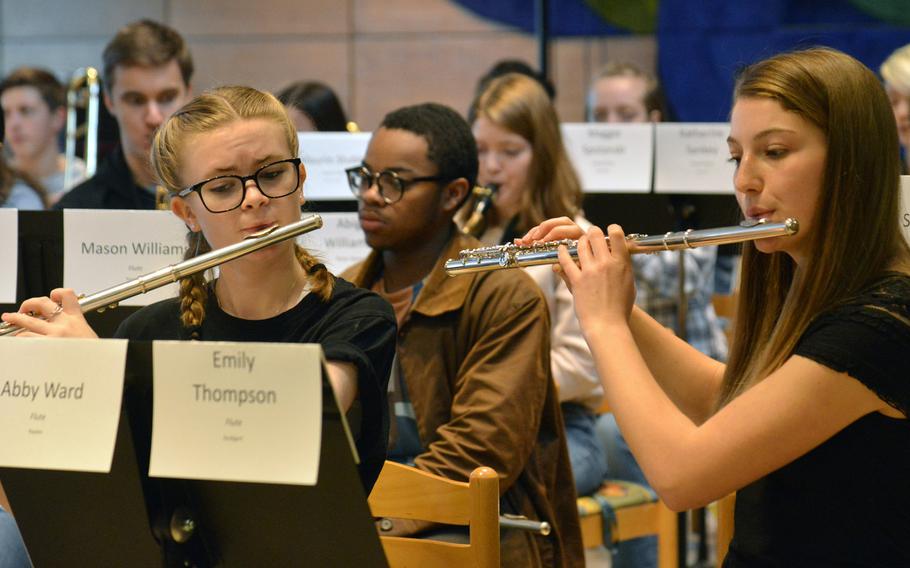 Abby Ward and Emily Thompson, flautists with the DODEA-Europe Honors Band rehearse a song at the Honors Music Festival, Tuesday, March 13, 2018.