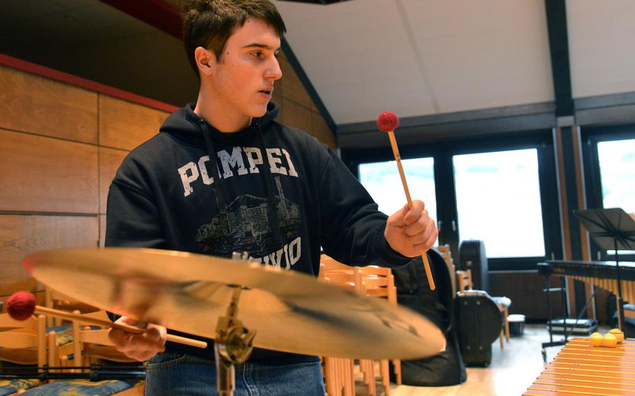 Percussionist Jonathan Ciero of Ramstein hits the cymbal as he rehearses a song with the band at the DODEA-Europe Honors Music Festival, Tuesday, March 13, 2018.