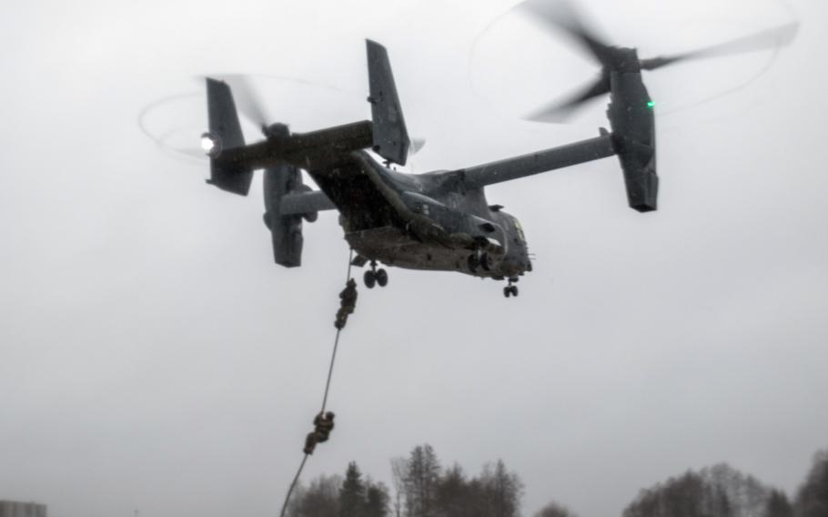 Estonian and U.S. Special Operation Forces operators fast rope out of a U.S. Air Force CV-22 Osprey, assigned to the 352d Special Operations Wing, during training near Amari, Estonia, Dec. 12, 2017.