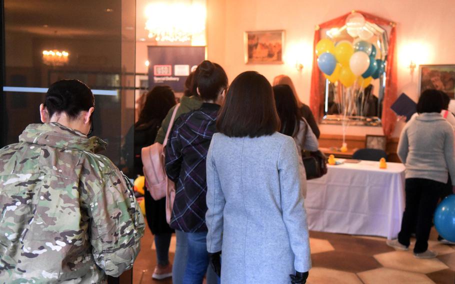 Expectant mothers from U.S. Army Garrison Bavaria line up at the Special Delivery baby shower event, at Grafenwoehr, Germany, Wednesday, March 14, 2018.