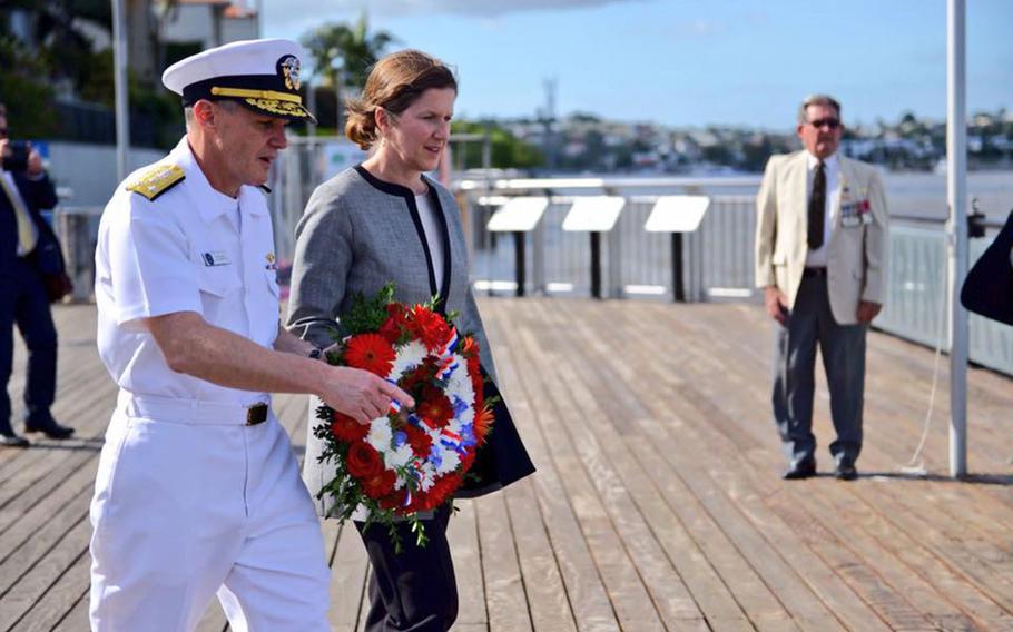 Vice Adm. Phil Sawyer, 7th Fleet commander, and U.S. Consul General Valerie Fowler prepare to lay a wreath at the Submariners Walk Heritage Trail in Brisbane, Australia, Thursday, March 15, 2018.