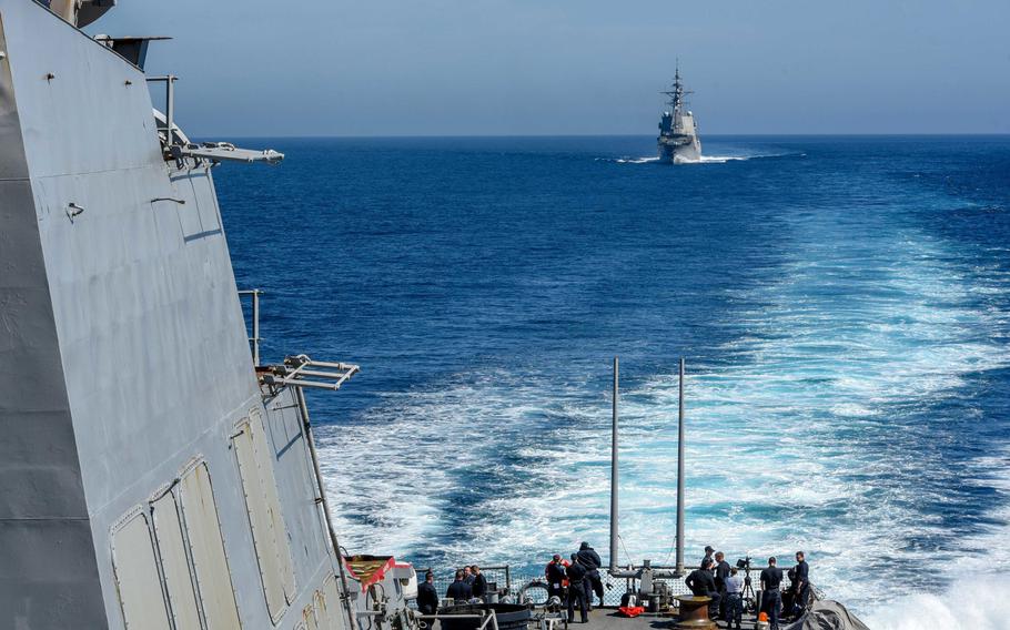 Sailors watch the Spanish frigate ESPS Cristobal Colon accompany the Arleigh Burke-class guided-missile destroyer USS Laboon during Dynamic Manta 2018  in the Mediterranean Sea.