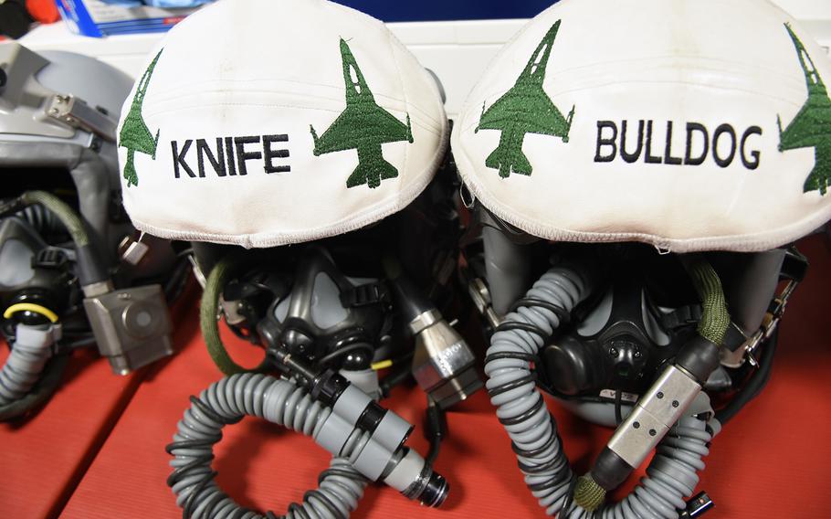 Helmets worn by F-16 pilots with the 480th Fighter Squadron at Spangdahlem Air Base, Germany, display pilots' call signs on Tuesday,  March 13, 2018.