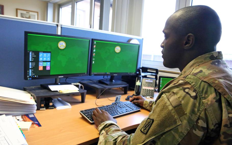 U.S. Army Staff Sgt. Johnnie Robinson, 2nd Theater Signal Brigade command group noncommissioned officer, uses a government computer with the Windows 10 operating system, Oct. 2, 2017, in Wiesbaden, Germany.