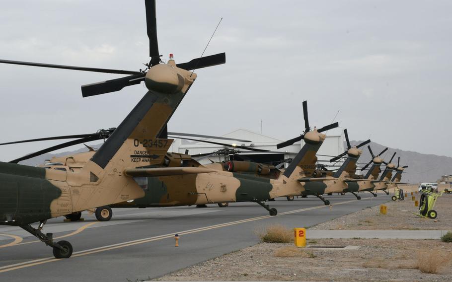 Some of Afghanistan's 11 UH-60 Back Hawks sit at Kandahar Air Filed, grounded by bad weather on Sunday, March 18, 2018.