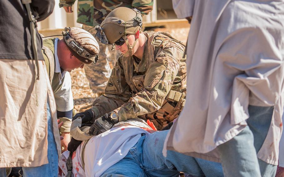 A U.S. Army sergeant with the 1st Security Force Assistance Brigade provides medical assistance to a role player portraying an Afghan national during a mission rehearsal exercise Jan. 15, 2018 at the Joint Readiness Training Center at Fort Polk in Louisiana. The 1st SFAB, the Army's first dedicated brigade of combat advisers, was preparing for a deployment this spring to Afghanistan.
