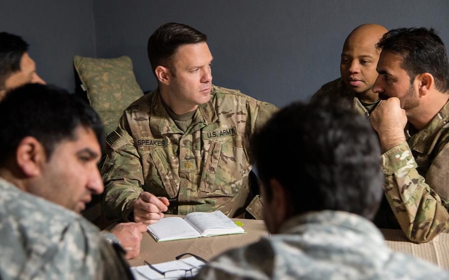 Army Maj. Brennan Speaks consults with Afghan-Americans portraying Afghan security forces during a training exercise for the 1st Security Force Assistance Brigade at the Joint Readiness Training Center at Fort Polk in Louisiana on Jan. 15. Speaks, the 1st SFAB's operations officer, and the brigade will aid Afghan soldiers this spring as Afghan forces launch offensives against the Taliban across the nation. 