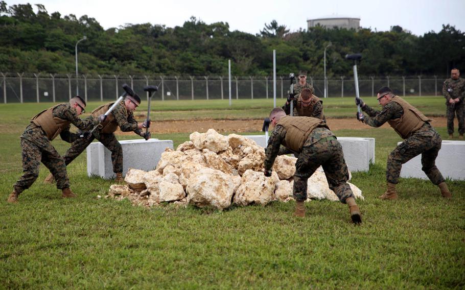 Marines put on a Correctional Custody Unit demonstration at Camp Hansen, Okinawa, Jan. 12, 2018.