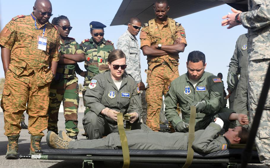 West Virginia Air National Guard medical technicians, assigned to the 167th Aeromedical Evacuation Squadron, demonstrate how to load a patient onto a litter at Captain Andalla Cissé Air Base, Senegal on March 22, 2018. The demonstration was part of African Partnership Flight Senegal that focuses on aeromedical evacuations.
