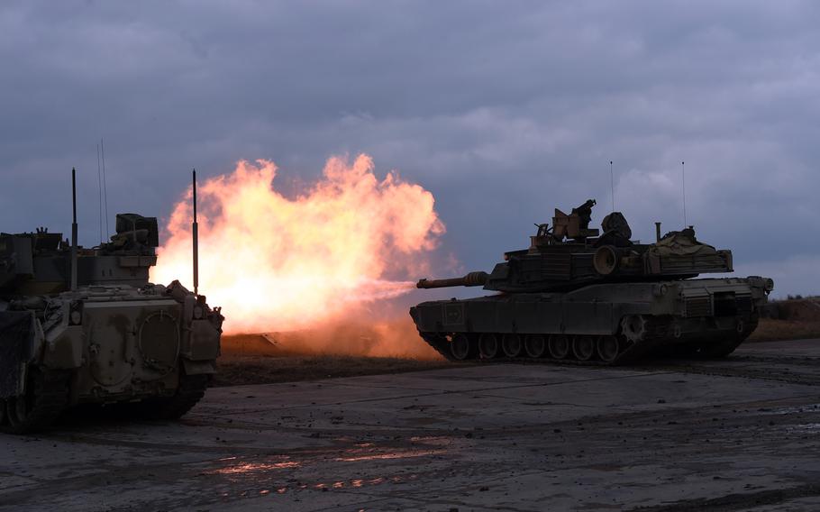An M1A2 Abrams tank fires during a live-fire exercise at Grafenwoehr, Germany, Wednesday, March 28, 2018. 