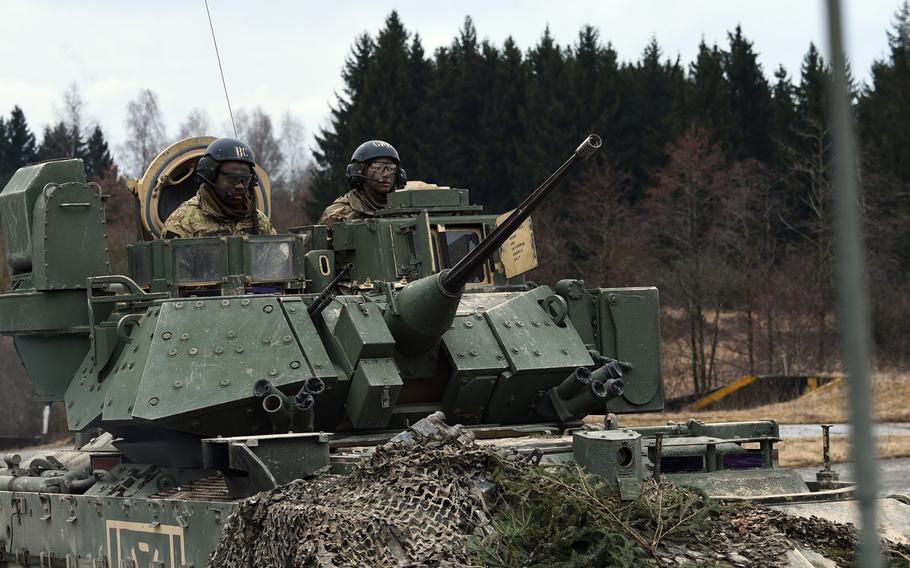 Soldiers with the 2nd Armored Brigade Combat Team in their Bradley Fighting Vehicle during a live-fire exercise at Grafenwoehr, Germany, Wednesday, March 28, 2018.