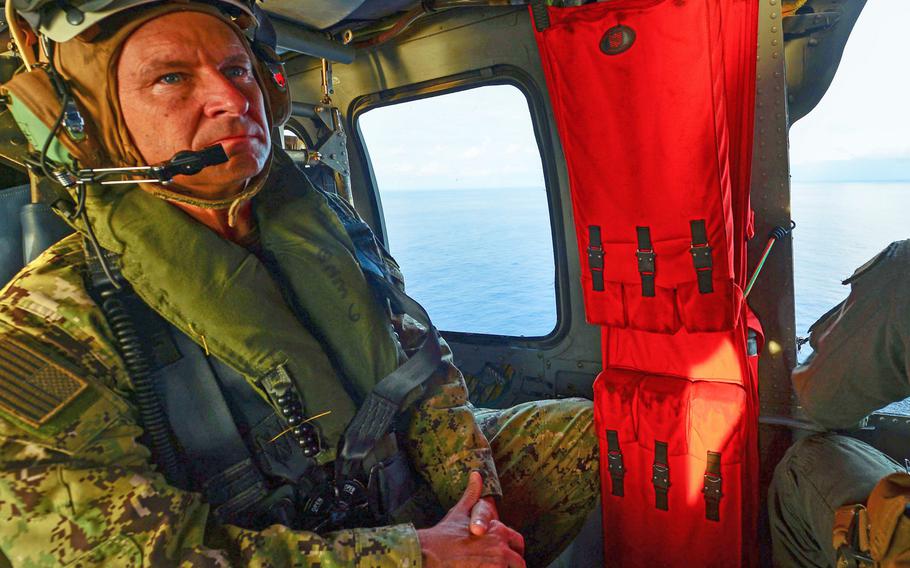Rear Adm. Shawn Duane, 6th Fleet vice commander, rides in a Sea Hawk helicopter while conducting flight operations on March 24, 2018, during Obangame Express. Sponsored by U.S. Africa Command, 31 countries took part in the exercise designed to strengthen cooperative policing in West African waters.