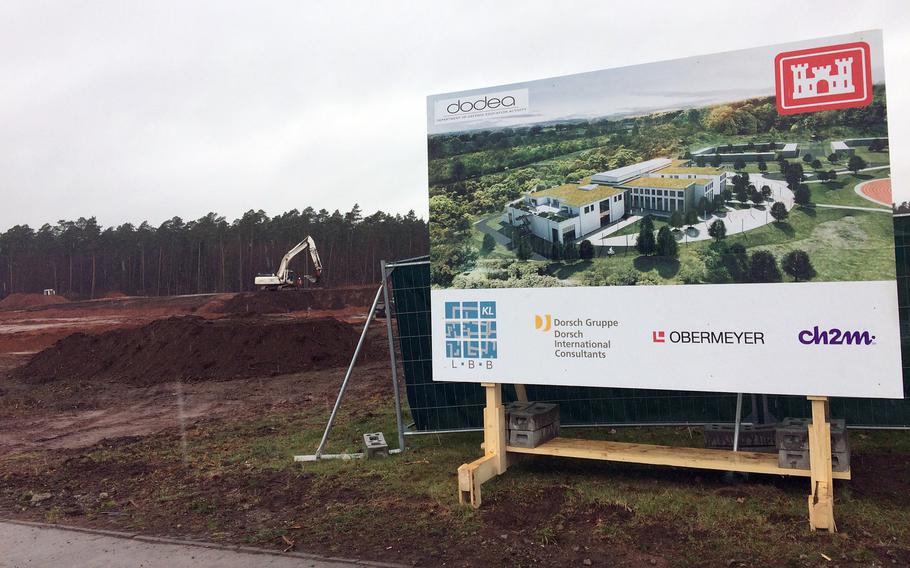 An architectural rending of the new Ramstein High School in Germany, as seen on March 28, 2018. In the background, construction crews have already started to dig up the ground where the new school will be built.
