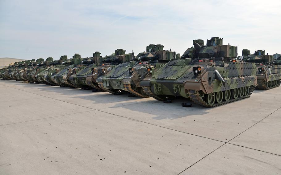 Rows of Bradley Fighting Vehicles sit in orderly lines at Coleman Barracks in Mannheim, Germany in June, 2017. The U.S. Army said Thursday it expects to hold onto the facility until at least 2021 given the base's key role in stockpiling thousands of pieces of equipment for the military?s beefed up Europe mission.