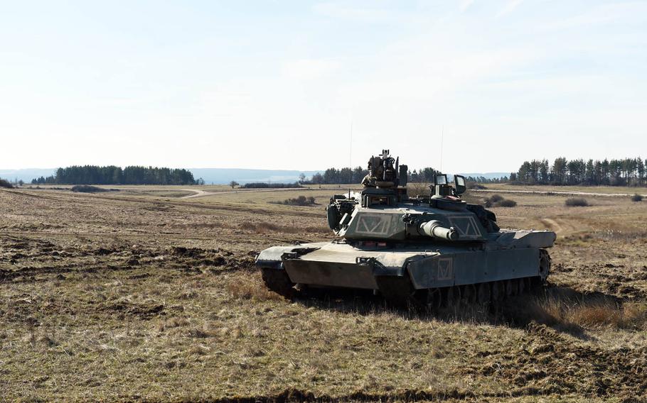 An M1A2 Abrams tank is ready to provide supressing fire during the Robotic Complex Breach Concept demonstration at Grafenwoehr, Germany, Friday, April 6, 2018.