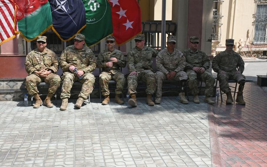 Navy Cmdr. William Danchanko, left, retired Army Staff Sgt. John Hosea, retired Army Staff Sgt. Jaymes Poling, retired Army Sgt. Franz Walkup, retired Marine Corps Sgt. Hubert Gonzalez, Army Sgt. Jonathan Harmon and retired Army Spc. Justin Lane participate in an operation Proper Exit ceremony at NATO's Resolute Support Headquarters in Kabul, Afghanistan on Saturday, April 7, 2018. 

Phillip Walter Wellman/Stars and Stripes