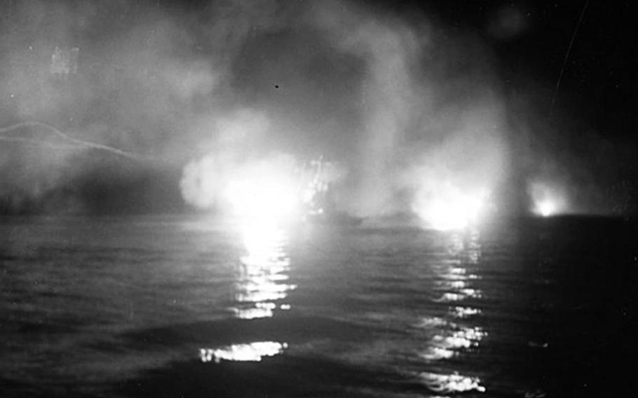 The light cruiser USS Helena, center, fires during the Battle of Kula Gulf, just before it was torpedoed and sunk by the Japanese, July 6, 1943.