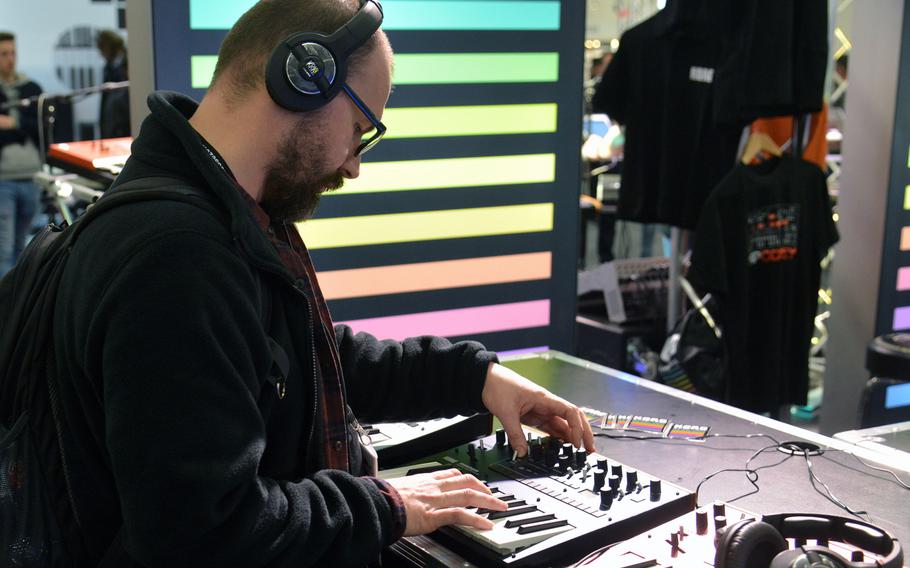 A visitor to the Musikmesse in Frankfurt, Germany, tries his hand at a Korg synthesizer, Wednesday, April 11, 2018.