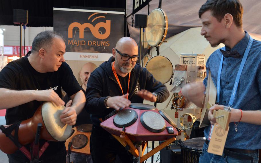 Musicians do what they do best at the Musikmesse in Frankfurt, Germany — play music. The instrument at center is called a hangar. It offers 7 tunable playing surfaces to the player, who in this case is percussionist Tony Liotta.
