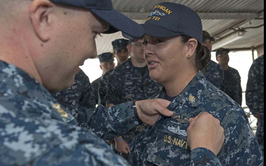 Chief Culinary Specialist Dominique Saavedra, assigned to the USS Michigan, is pinned with her enlisted submarine qualification at Puget Sound Naval Shipyard, Aug. 2, 2016. The Navy has extended the deadline for female enlisted sailors to convert to submarine force ratings. 
