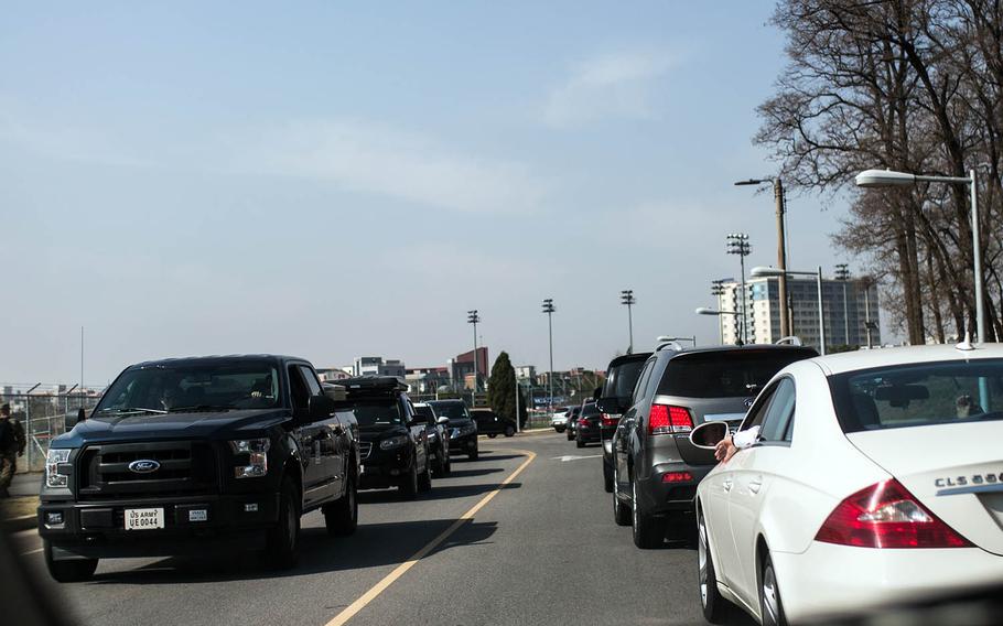 Traffic backs up at Camp Humphreys, South Korea, after a false report that a vehicle ran one of the gates, Wednesday, April 18, 2018.