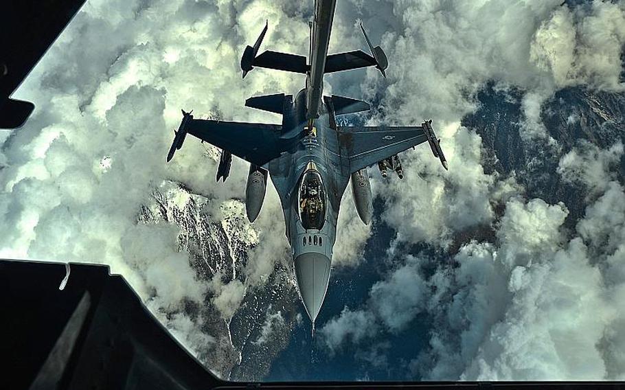 A U.S. Air Force F-16 Fighting Falcon pilot assigned to the 455th Air Expeditionary Wing, Bagram Air Field, Afghanistan, prepares to receive fuel over Afghanistan from a KC-10 Extender, March 9, 2018.