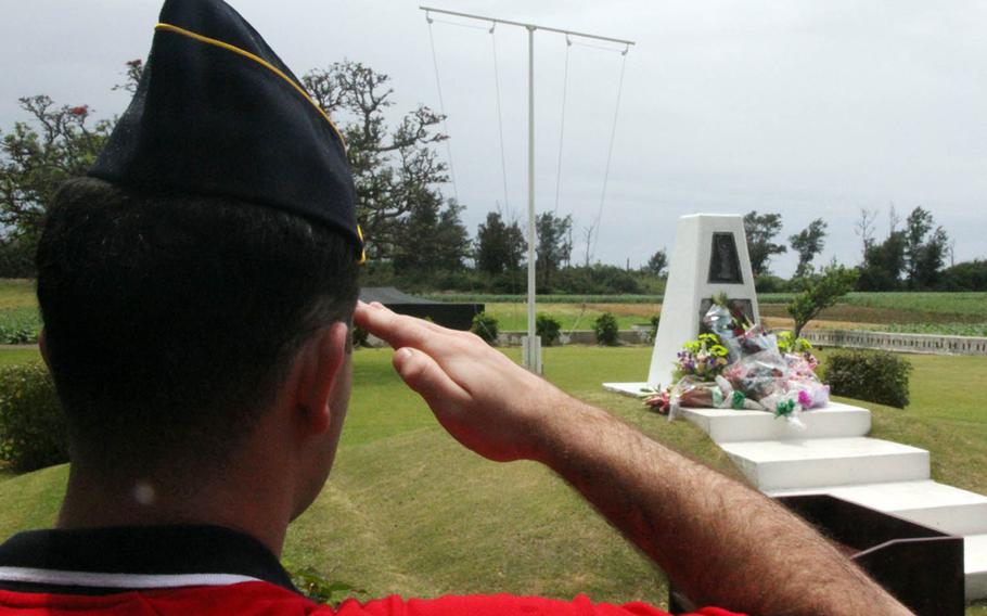A member of American Legion Post 28 in Okinawa, Japan, renders salute during a ceremony honoring famed war correspondent Ernie Pyle, in Okinawa, Japan, Sunday, April 23, 2018.