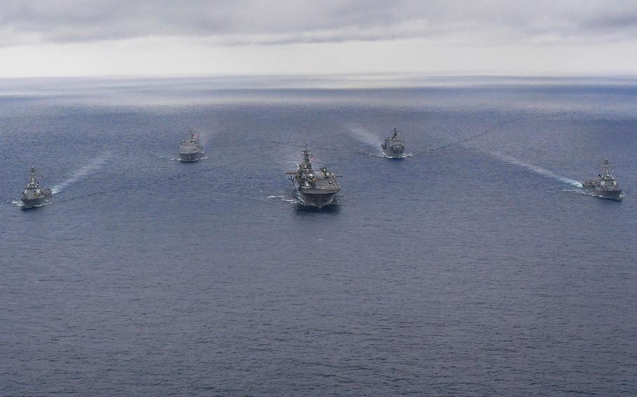 The USS Wasp strike group, which includes the USS Dewey, from left, the USS Green Bay, the USS Wasp, the USS Ashland and the USS Sterett, steams in formation in the Philippine Sea, April 17, 2018.