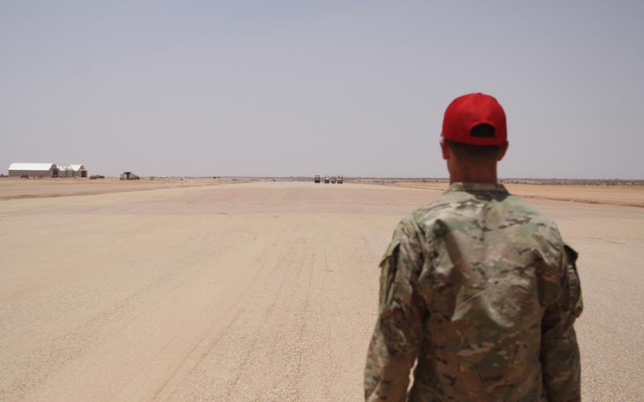 U.S. Air Force Capt. Tim Lord looks out at the runway being built in Agadez, Niger, where the Air Force is nearing completion of its largest construction project ever. The runway, to be used by drones and other aircraft, is more than a mile long.