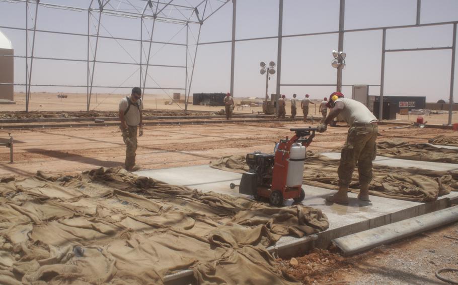 Airmen work in the unmanned aerial device apron in Agadez, Niger, where drones will be parked when they are not in operation.