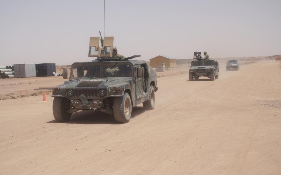 Troops patrol the perimeter of a Nigerien air base in Agadez, part of which is under the exclusive control of U.S. forces. The site will be a hub for American surveillance operations in the region.