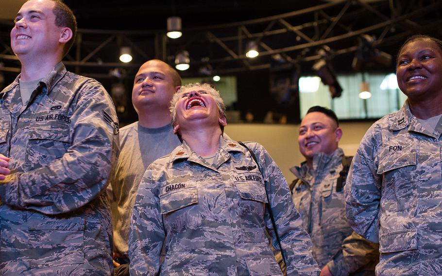 Airmen laugh during a USO show featuring sevearl celebrities at Osan Air Base, South Korea, Monday, April 23, 2018.